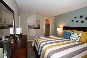 Winston-Salem apartment for rent - a bedroom with a striped bed