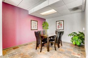 Aurora apartment for rent - a dining room with a table and chairs