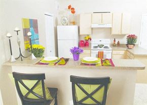 Aurora apartment for rent - a kitchen with a counter and two chairs
