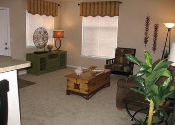 Aurora apartment for rent - a living room with a couch and a table