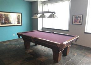 Aurora apartment for rent - a pool table in a room with a window