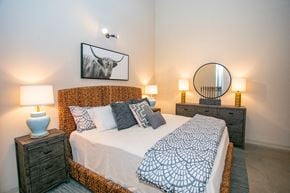 Columbus apartment for rent - a bedroom with a bed and a mirror
