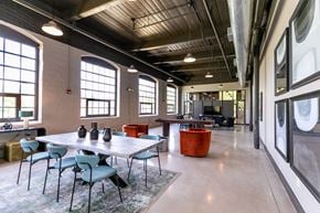 Columbus apartment for rent - a dining room with a table and chairs in a room with large windows