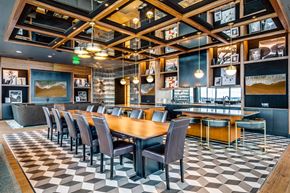 Seattle apartment for rent - a dining room with a long table and chairs