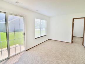 Kalamazoo apartment for rent - an empty living room with glass doors and a window