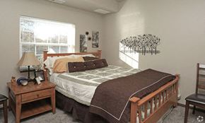 Owatonna apartment for rent - a bedroom with a bed and a window
