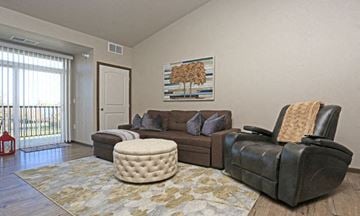Owatonna apartment for rent - a living room with a couch and a chair