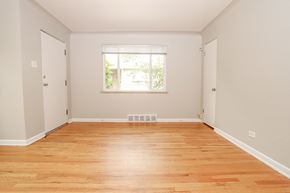 Denver apartment for rent - an empty room with wood floors and a window