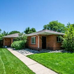 Denver apartment for rent - a brick house with a sidewalk and grass