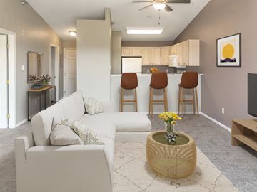 Sioux Falls apartment for rent - a living room with a couch and a table in front of a kitchen