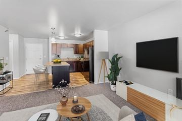 Sioux Falls townhouse for rent - an open living room with a kitchen and a tv