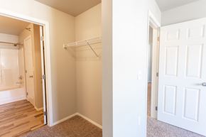 Sioux Falls townhouse for rent - a bedroom with a closet and a door to a bathroom