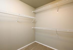 North Sioux City townhouse for rent - a spacious walk in closet with shelves and a hanging rack