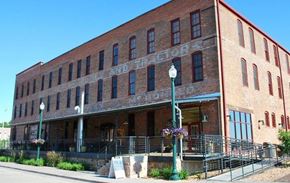 Sioux Falls apartment for rent - a large brick building with an old sign on it