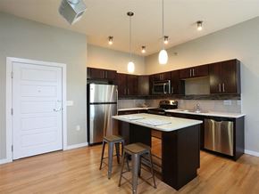 Sioux Falls apartment for rent - a kitchen with an island and stainless steel appliances