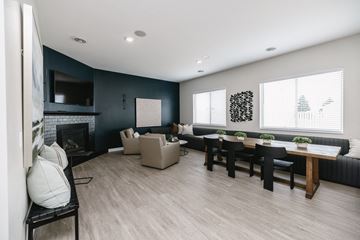 North Sioux City apartment for rent - a living room with a fireplace and a table and chairs