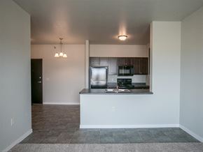 Sioux Falls apartment for rent - a kitchen with a counter top and a refrigerator