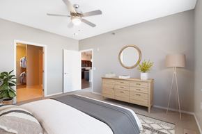 Sioux Falls apartment for rent - a bedroom with a bed and a ceiling fan