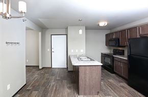 Sioux Falls townhouse for rent - a kitchen with wood flooring and a counter top in a new home