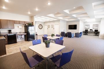 Sioux Falls townhouse for rent - a conference room with a table and chairs and a kitchen