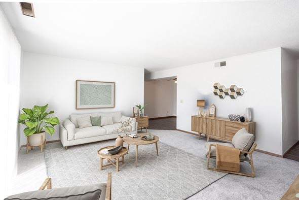 Sioux Falls apartment for rent - a living room with a white couch and a table