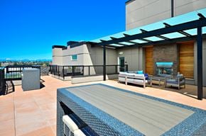Seattle apartment for rent - a rooftop deck with a pool and a fireplace