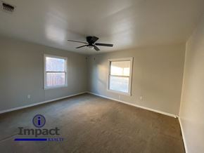 Abilene house for rent - A room with Impact Realty logo on the floor.