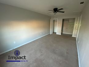 Abilene house for rent - A room with Impact Realty logo on the floor.