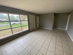 Abilene house for rent - the living room of an empty house with a large window