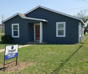 Abilene house for rent - a blue house with a for sale sign in front of it
