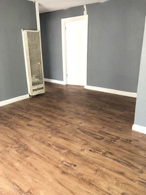 Abilene house for rent - a living room with gray walls and a hard wood floor