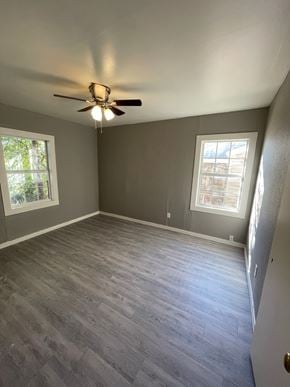 Abilene house for rent - A room with a ceiling fan and a window.