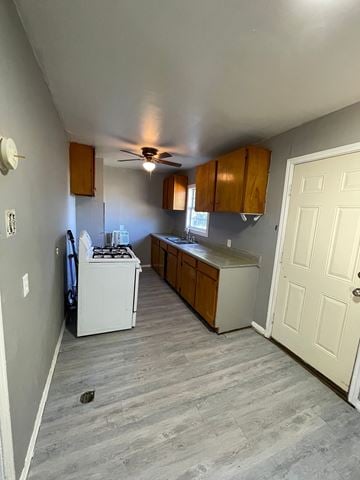 Abilene house for rent - A kitchen with a white fridge and a white stove.