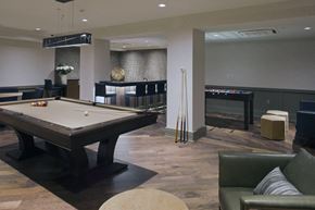 Peekskill apartment for rent - a game room with a pool table and a bar