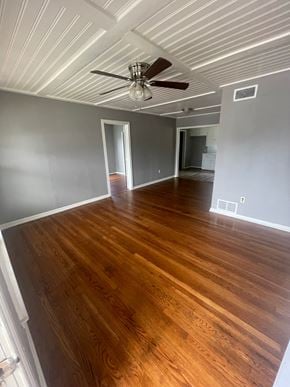 Abilene house for rent - an empty living room with wood floors and a ceiling fan