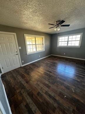 Abilene house for rent - a living room with a hard wood floor and a ceiling fan