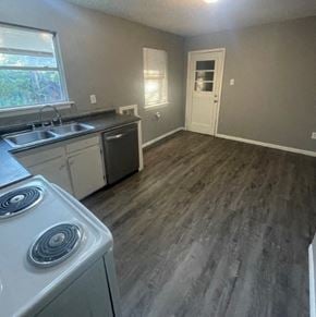 Abilene house for rent - an empty kitchen with a stove and a sink