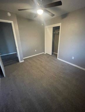 Abilene house for rent - a empty living room with a ceiling fan