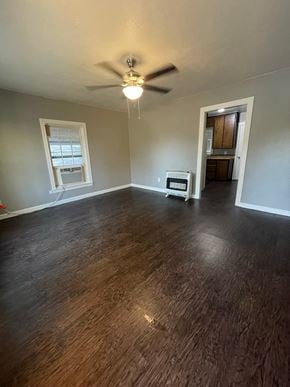 Abilene house for rent - an empty living room with wood floors and a ceiling fan