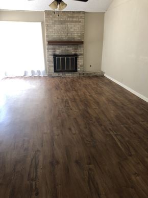 Abilene house for rent - the living room has a hard wood floor and a fireplace