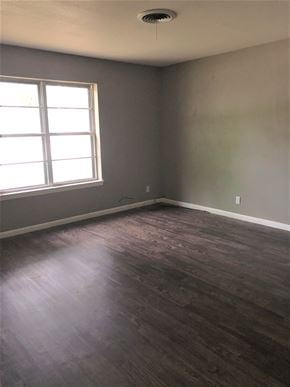 Abilene house for rent - A room with a window and a wooden floor.