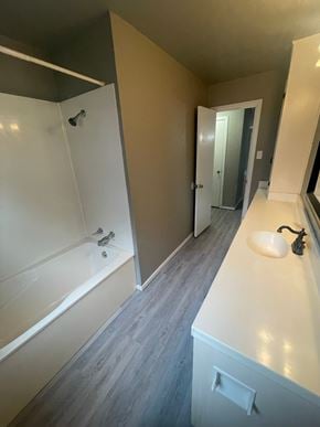 Abilene house for rent - A white bathroom with a tub and sink.