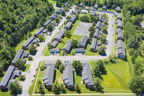 Watertown apartment for rent - an aerial view of a neighborhood with houses and trees