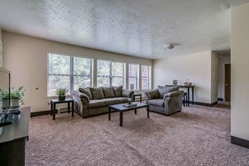 Watertown apartment for rent - a living room with couches and a coffee table