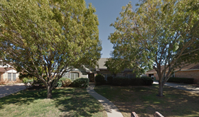 Abilene house for rent - the front of a house with trees and a sidewalk