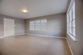 Abilene apartment for rent - Empty room with a window and a door.