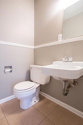 Abilene apartment for rent - A white toilet sits next to a sink in a bathroom.
