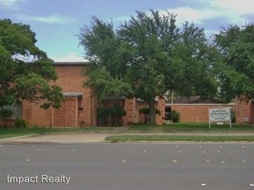 Abilene apartment for rent - A building with a sign that says Impact Realty.