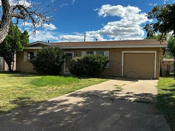 Abilene house for rent - A house with a driveway in front of it.