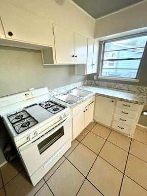 Abilene house for rent - a kitchen with a stove and a sink